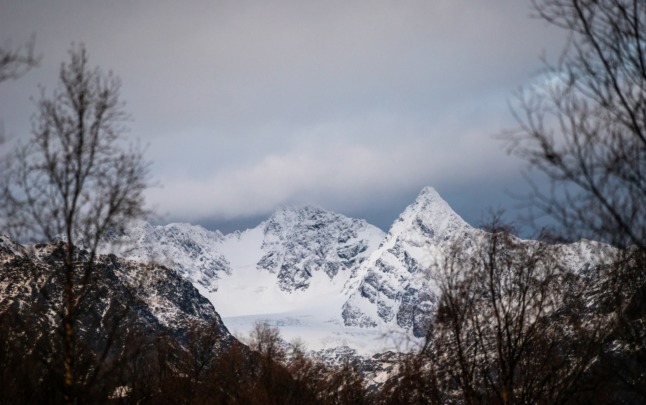 Pictured are the snow capped mountains of the Lyngen Alps 