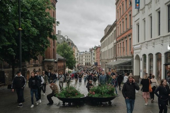 Pictured are people on Karl Johan Street in Oslo. 